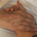holding elderly hand