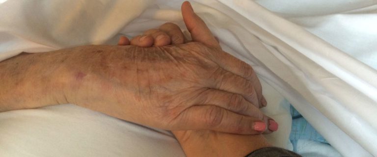 holding elderly hand